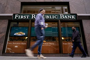Pedestrians walk past the headquarters of First Republic Bank in San Francisco