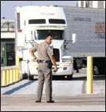 State safety inspector prepares to weigh a Mexican truck at border crossing in Laredo, Texas.