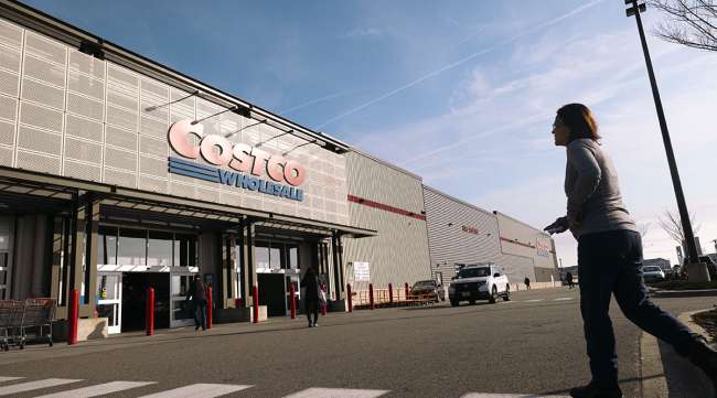 Customer walking toward Costco store