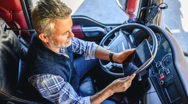 Truck driver on tablet