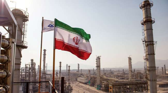 Iran flag flies at oil refinery in country