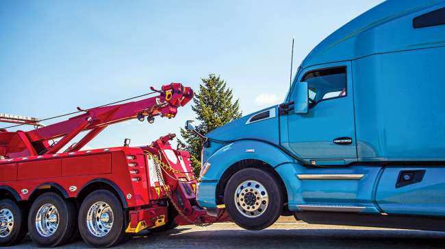 Image of truck being towed