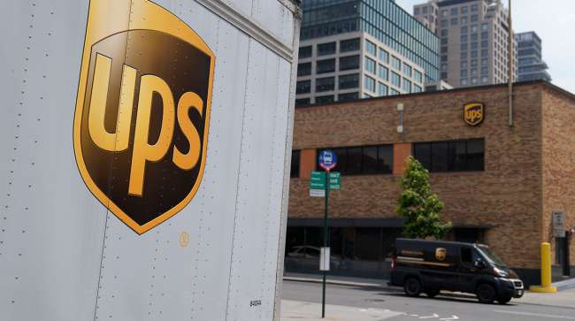 a close up of a ups truck parked on a city street