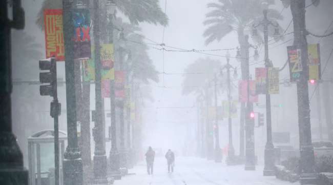 Snow falls on Canal Street in New Orleans