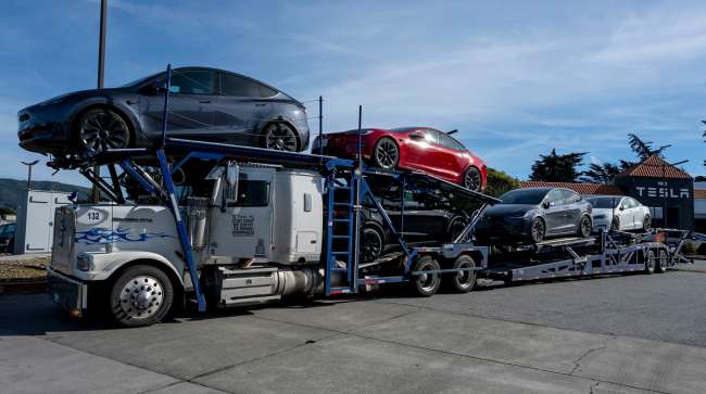 Tesla vehicles on a driveaway tractor