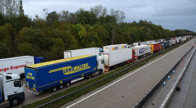 Lines of trucks are seen queued along the M20 motorway near Ashford, England, on Sept. 24.