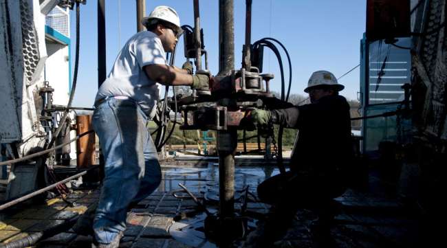 Employees work on a Chesapeake Energy natural gas rig in Texas in November 2009.