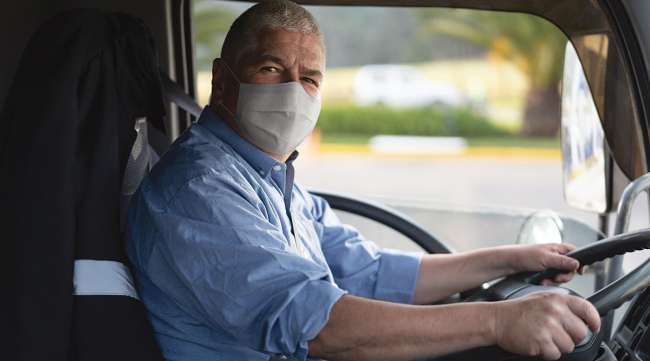 Truck driver wearing mask