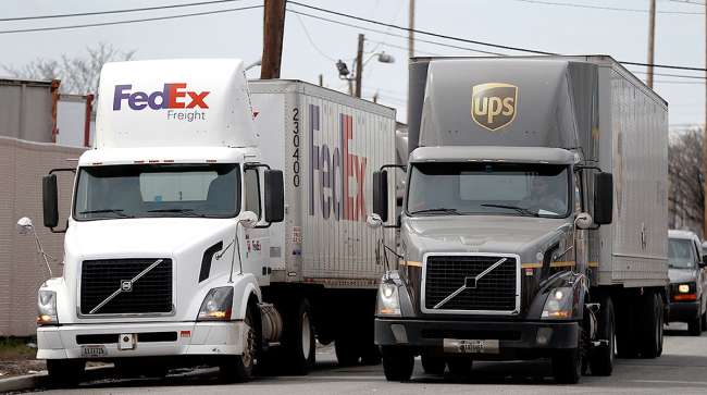 FedEx and UPS trucks