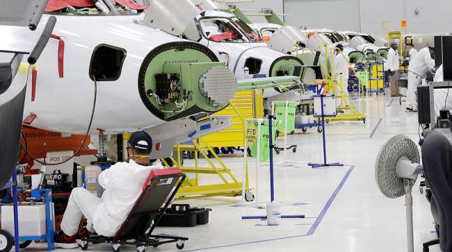 Workers in the production area at the Honda Aircraft Co. headquarters in Greensboro, N.C. (Gerry Broome)