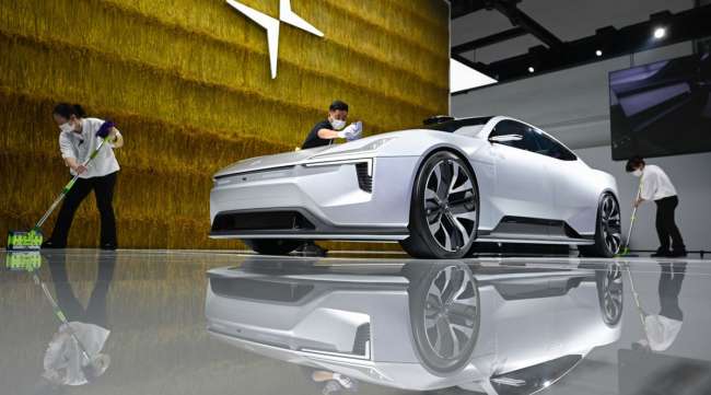 Polestar staff cleans a concept car at the Beijing Auto Show. (Wang Zhao/AFP/Getty Images)