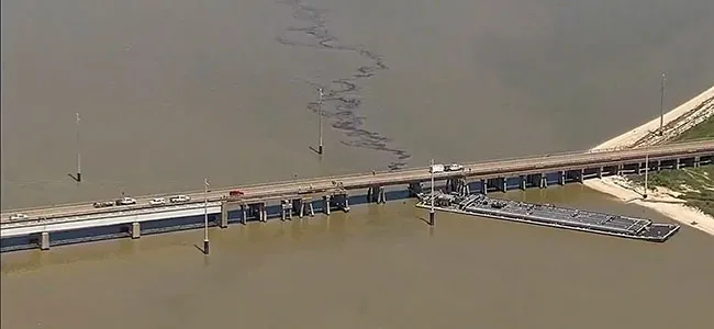 Oil spills into water near the bridge in Galveston, Texas