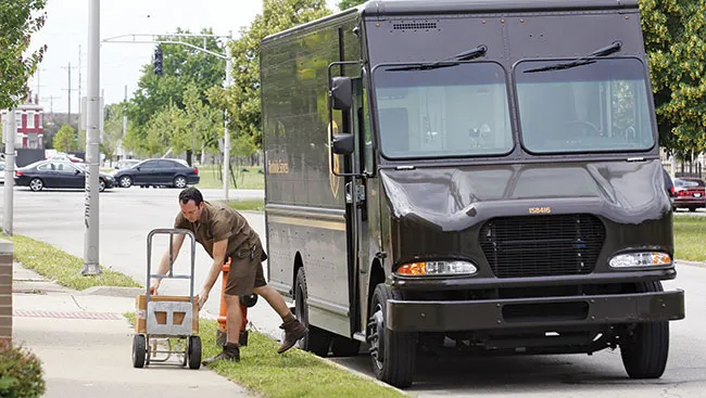 UPS driver unloading van