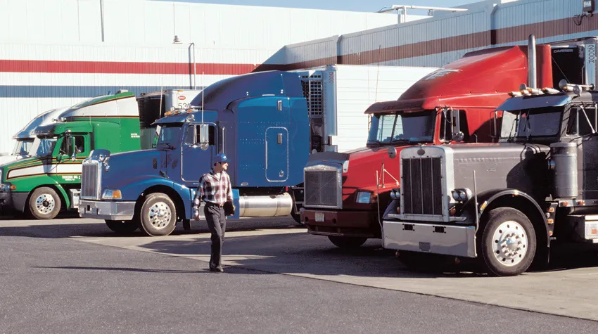 Driver and trucks in lot