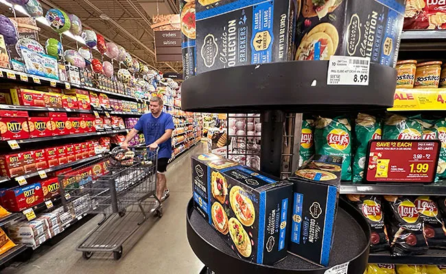 A man shopping at a grocery store