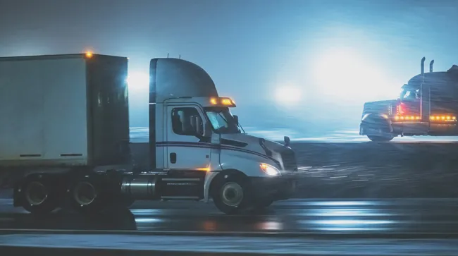 Two trucks on road