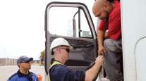 Truck driver getting credentials checked