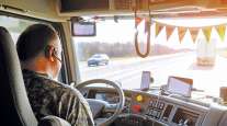 Driver in cab with truck technology