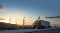 Truck in front of wind turbines