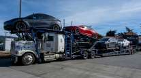 Tesla vehicles on a driveaway tractor