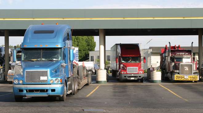 Trucks fueling at a truck stop