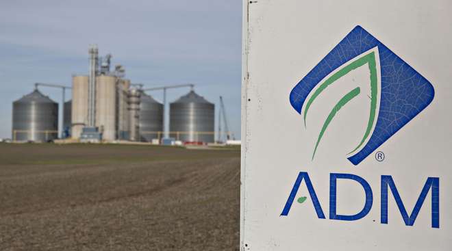 ADM sign with plant in background