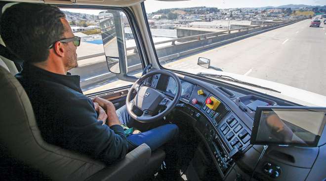 Driver in cab of autonomous truck