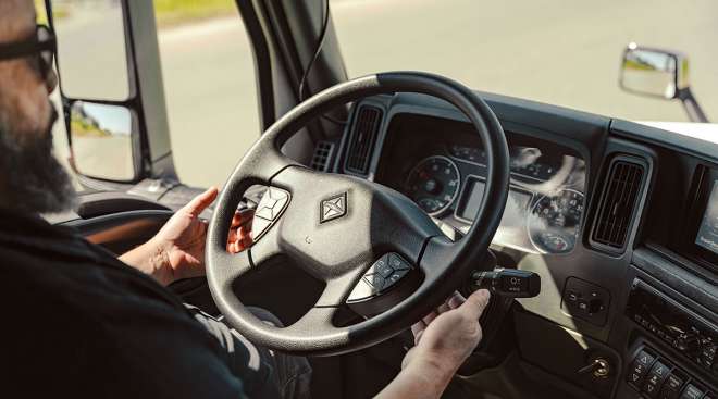 Safety driver in cab of autonomous truck