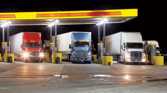 Trucks fueling at a truck stop